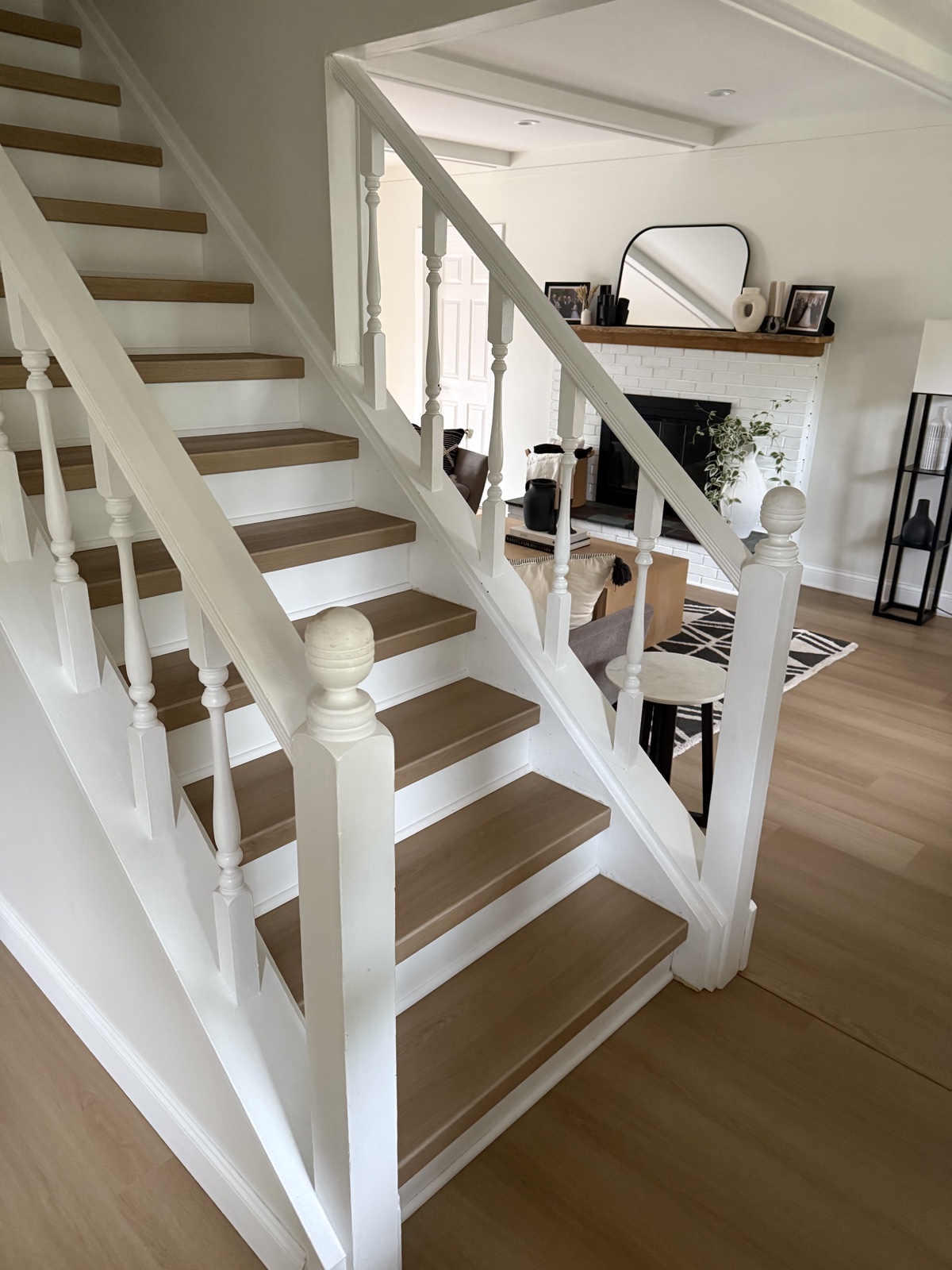 Completed custom vinyl stair treads coordinated with luxury vinyl plank flooring